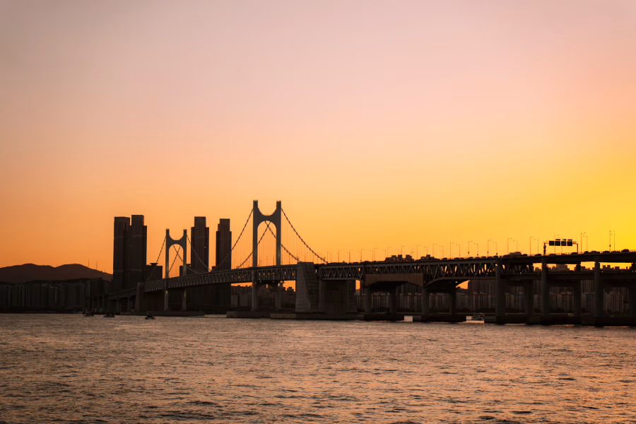 The sky glowing orange at sunset above Gwangan Bridge, Busan