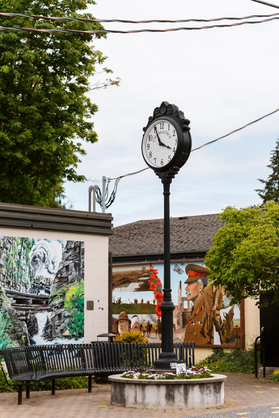 Several murals are painted on the sides of buildings in Chemainus