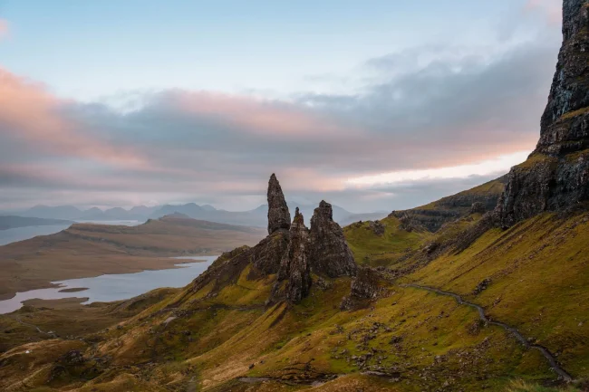 Clouds glowing pink above the rocky pillars of the Old Man of Storr on The Isle of Skye