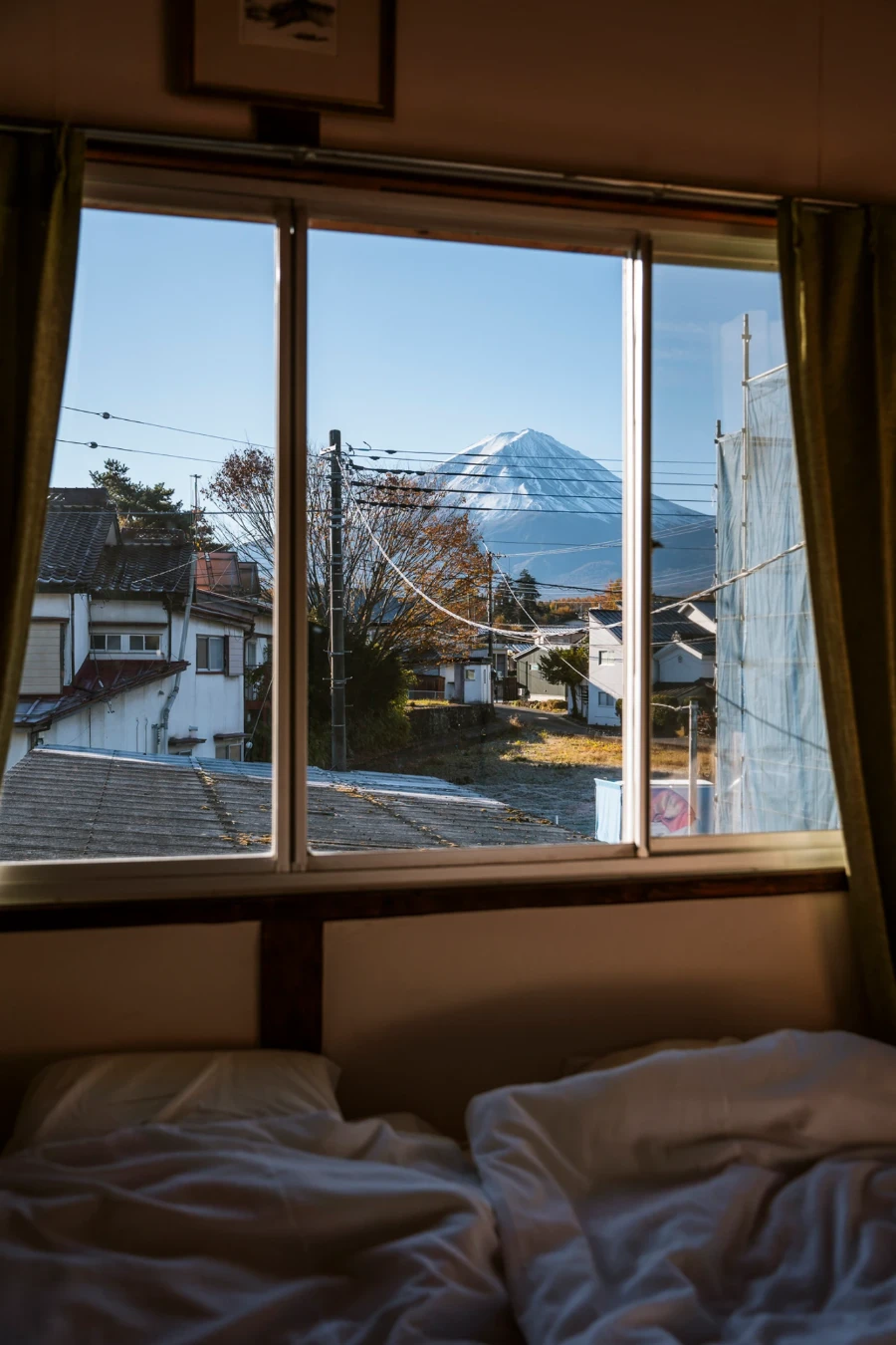 Mt. Fuji visible through a hotel window on a clear day
