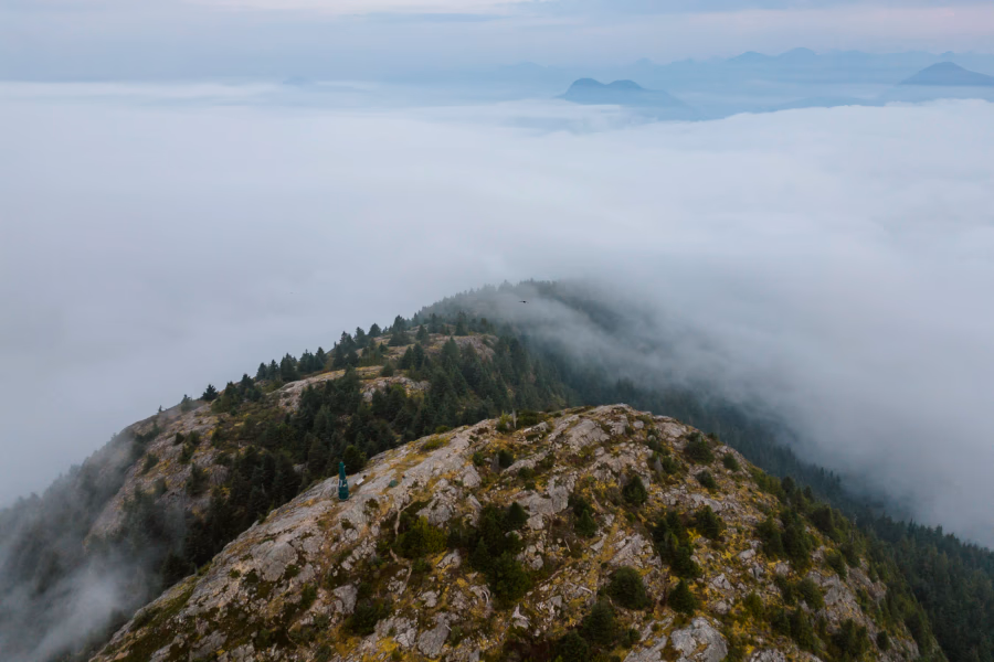 Tin Hat Mountain during a cloud inversion where the peak is visible but the rest of the mountain is shrouded in clouds