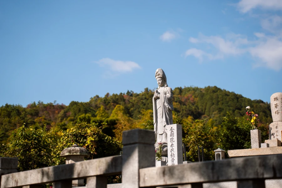 Stone statue of a praying buddha at Tenryu-ji Temple
