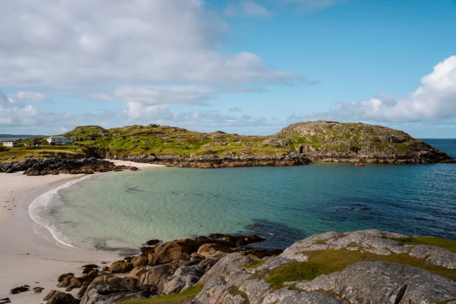 Gentle waves rolling into the protected cove and onto Achmelvich Beach, Assynt
