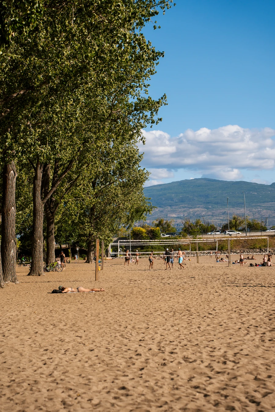 Several volleyball nets set up in the sand at Hot Sands beach in Kelowna