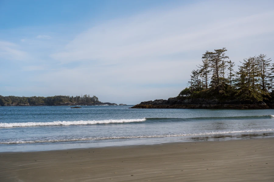 Calm waves roll into the sandy shores of Chesterman Beach in Tofino