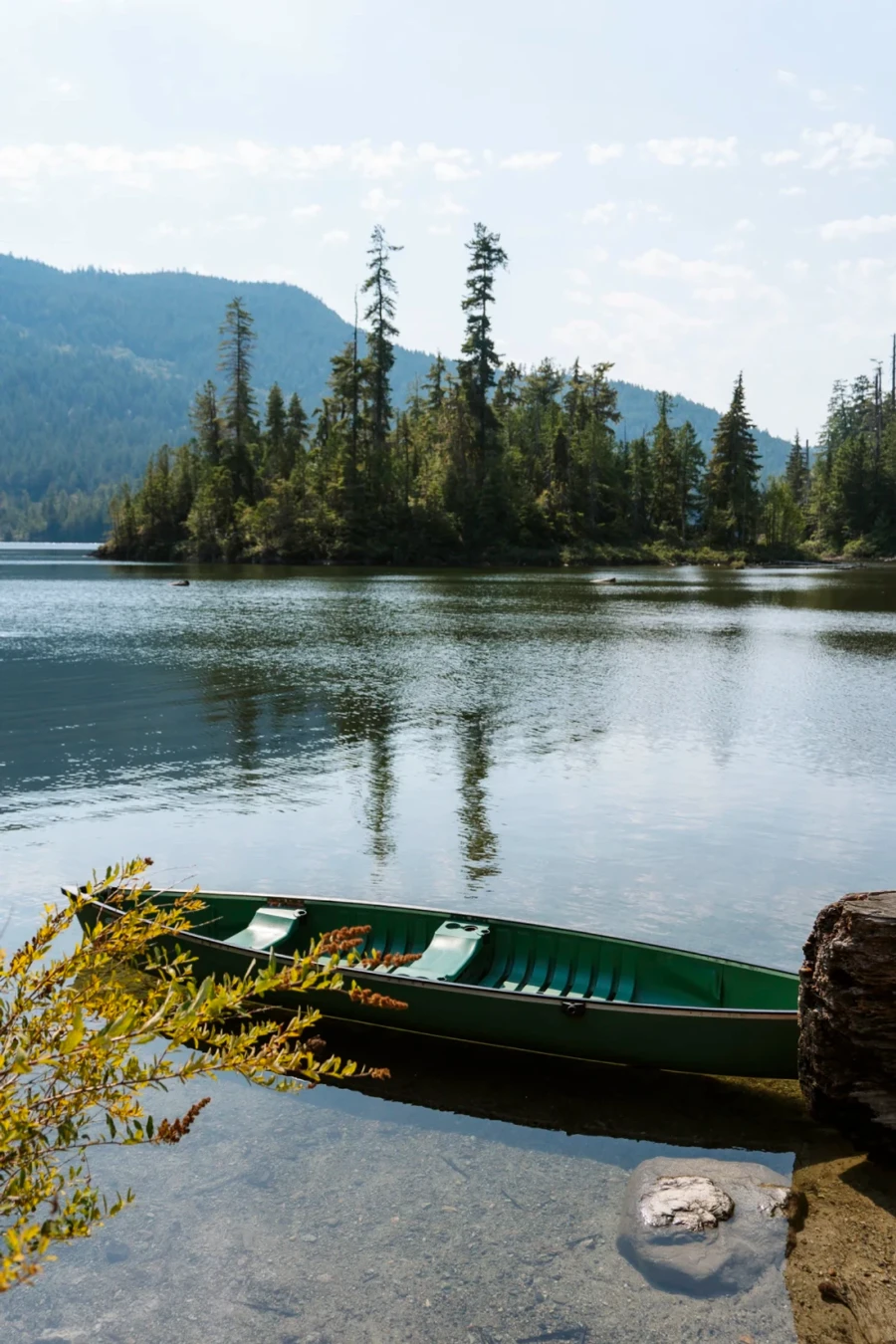 canoe sitting in the shallow waters at the edge of Waugh Lake near Egmont, BC