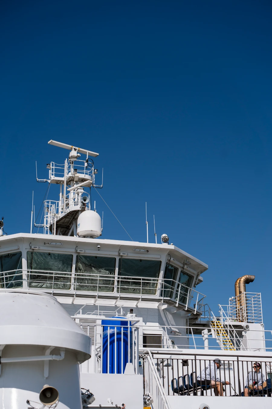 The control tower of a BC ferry cast against a clear blue sky