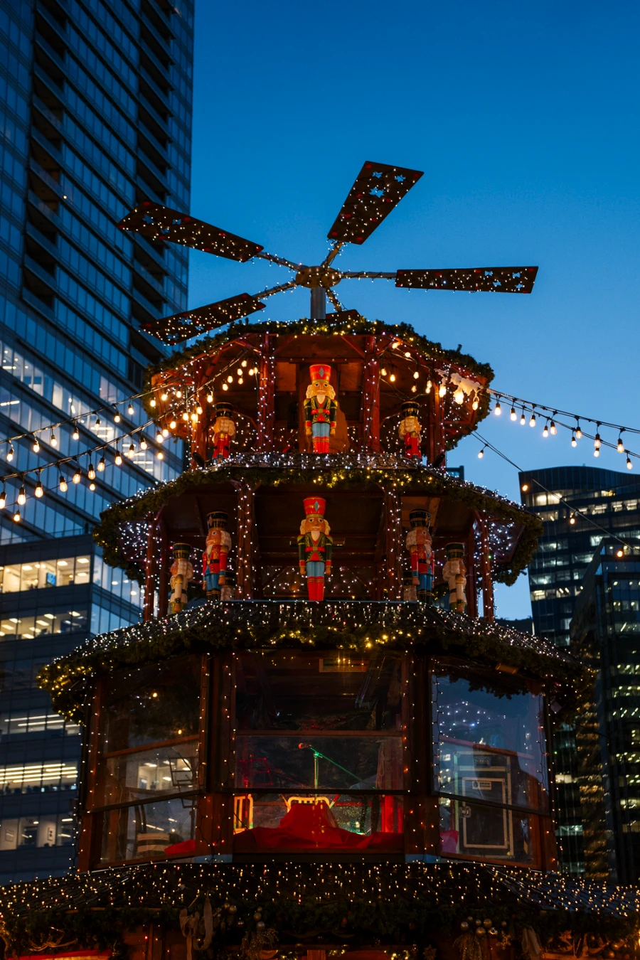 Multi story christmas themed display with lights and ornate nutcracker statues at the Downtown Vancouver Christmas Market