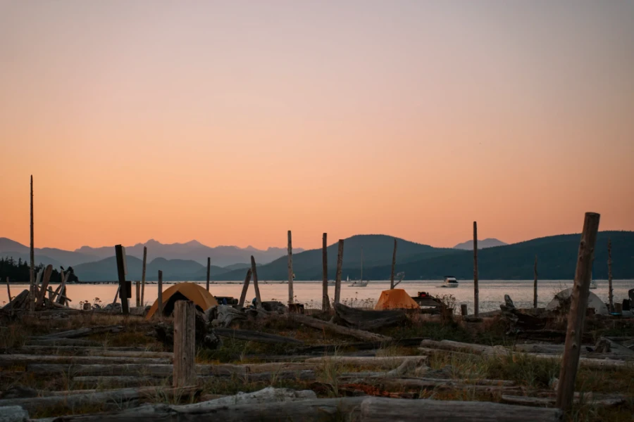 Several tents set up at the Thormanby Island campsites at sunset