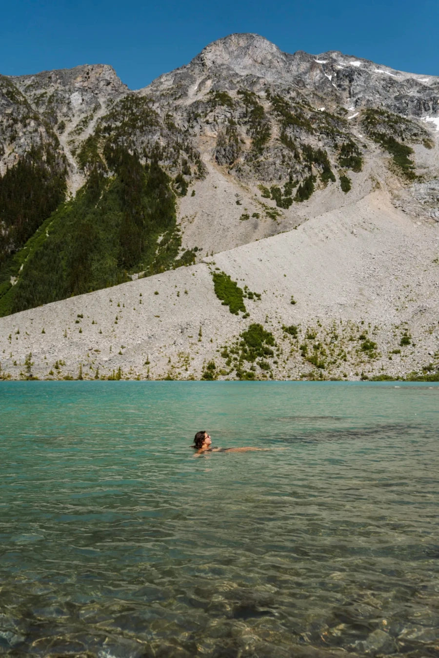 A woman Swimming in Upper Joffre Lake