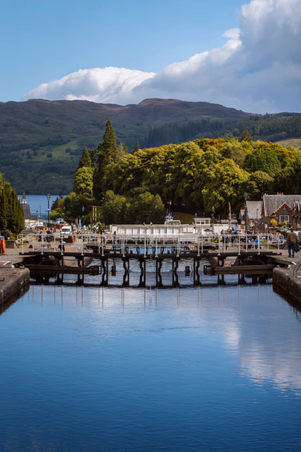 Calm water sits contained by closed Locks in For Augustus, Scotland