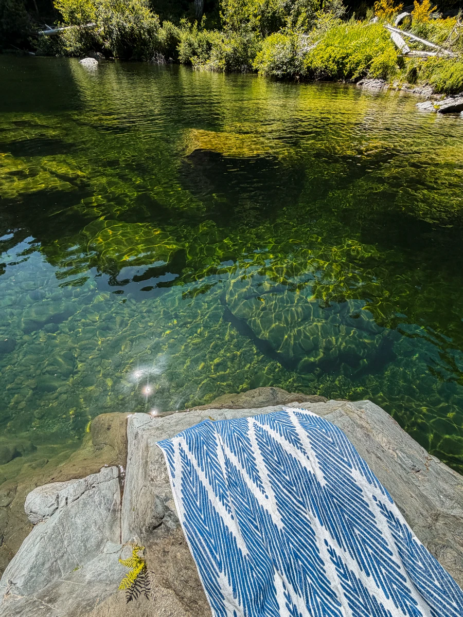 Clear turquoise water and sunlit rock ledge at Sooke Potholes Provincial Park near Victoria, British Columbia.