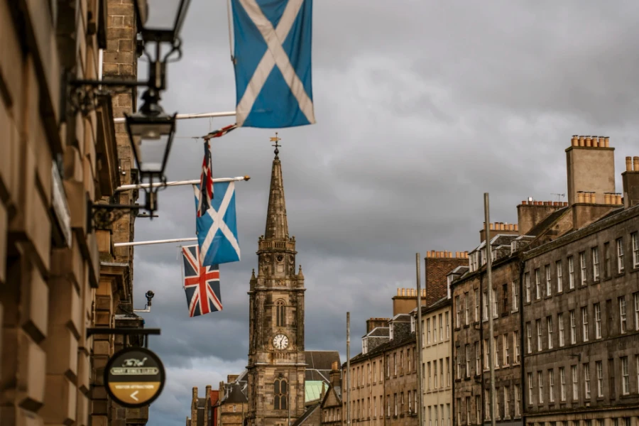 UK and Scottish flags hang over the The Royal Mile in Edinburgh, Scotland