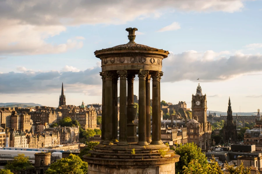 Edinburgh’s Disgrace atop Calton Hill with golden sunset light cast on it