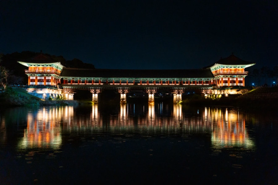 Two pagoda's are connected by the Woljeonggyo Bridge which is reflected in the river it crosses