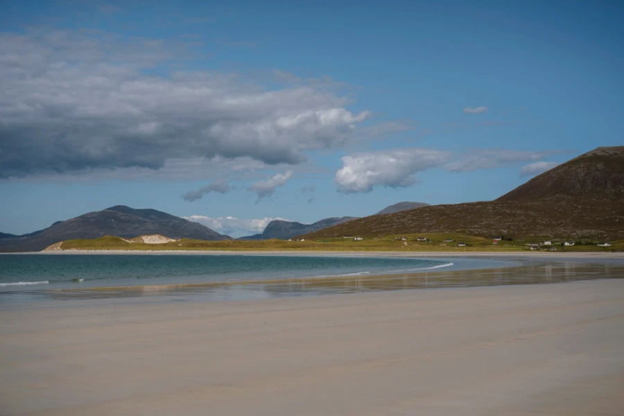 Gentle waves approach a white sand beach on The Isle of Harris