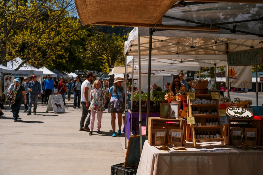 Crowds of people brose the artisan stands at the Salt Spring Farmers Market
