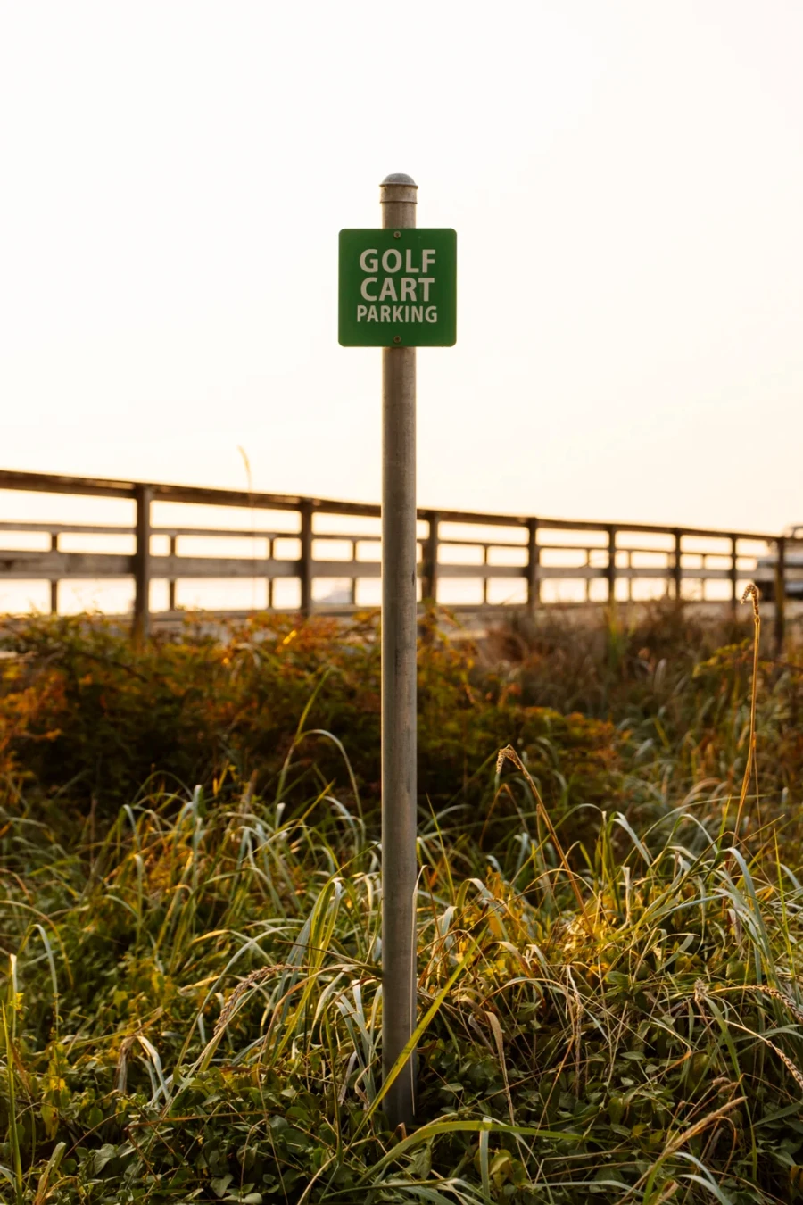 A small sigh reads golf cart parking