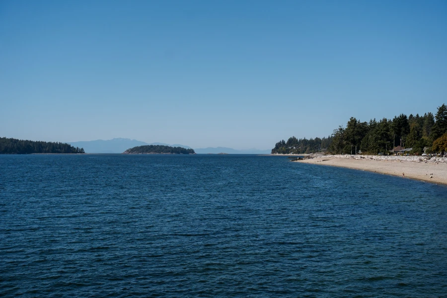White sand beach and calm water in the Sechelt Inlet