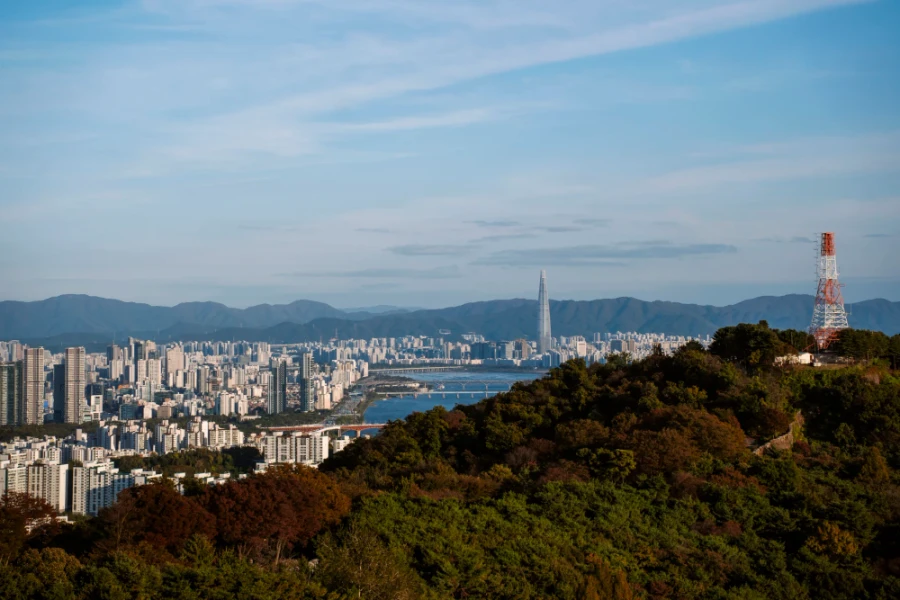 The skyline of Seoul South Korea with mountains rising behind the city