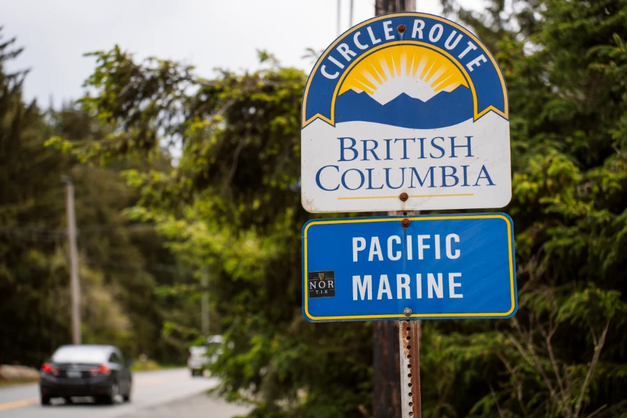 A blue and white road side sign reads ‘Circle Route British Columbia Pacific Marine’