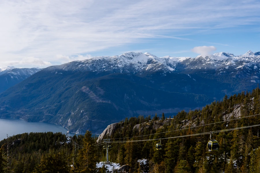 A series of cable cars climbing up the side of the mountain at The Sea To Sky Gondola in Squamish