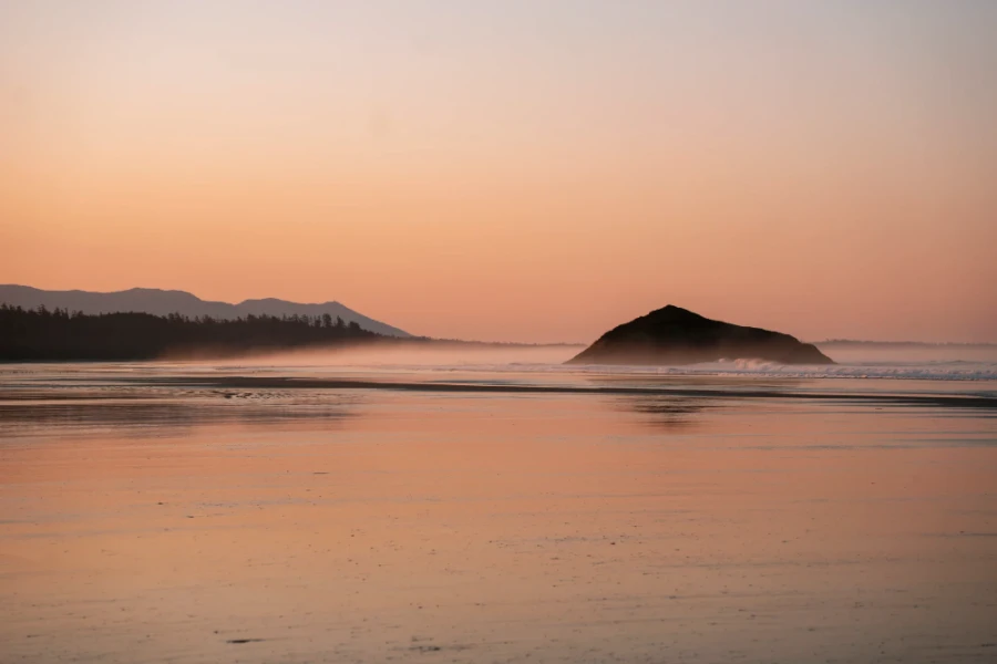 Mist glowing pink at sunset at Long Beach in Tofino, BC