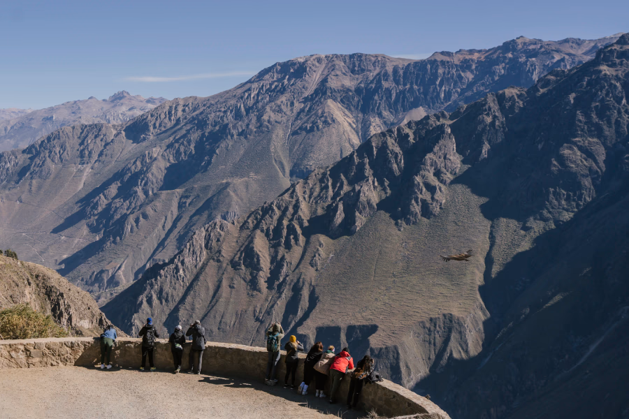Best Things to Do In Arequipa: Tourists at a viewpoint overlooking Colca Canyon