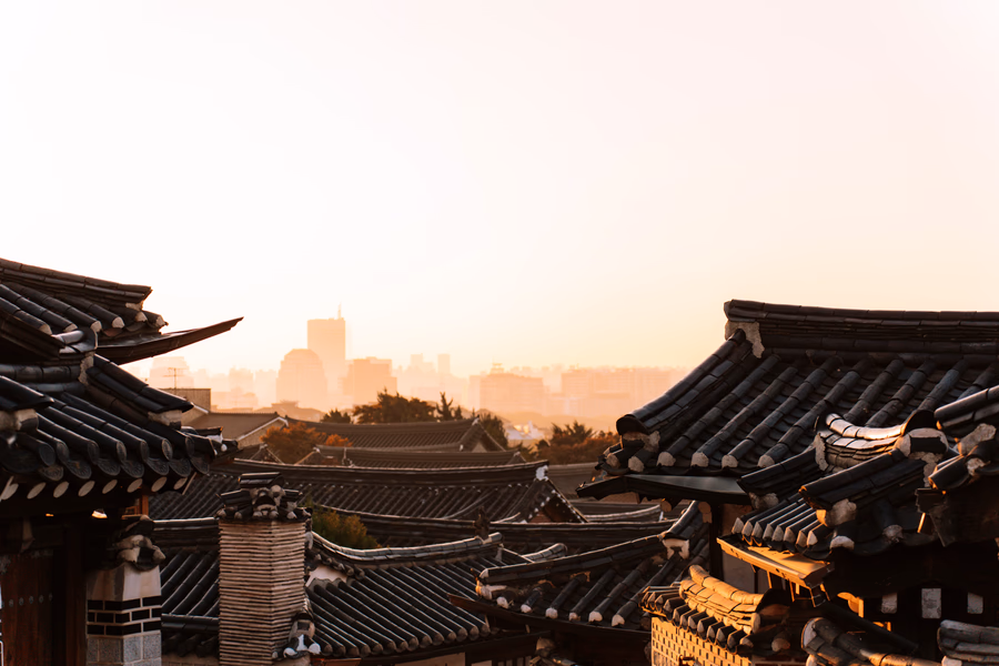 rows of hanok house's roofs at sunrise