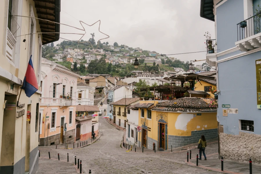 An empty cobblestone street lined with colorful buildings
