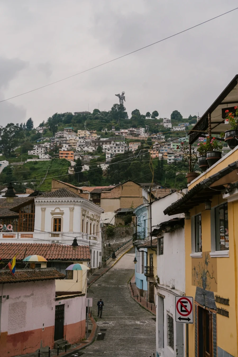 An empty street leading to a view of El Panecillo