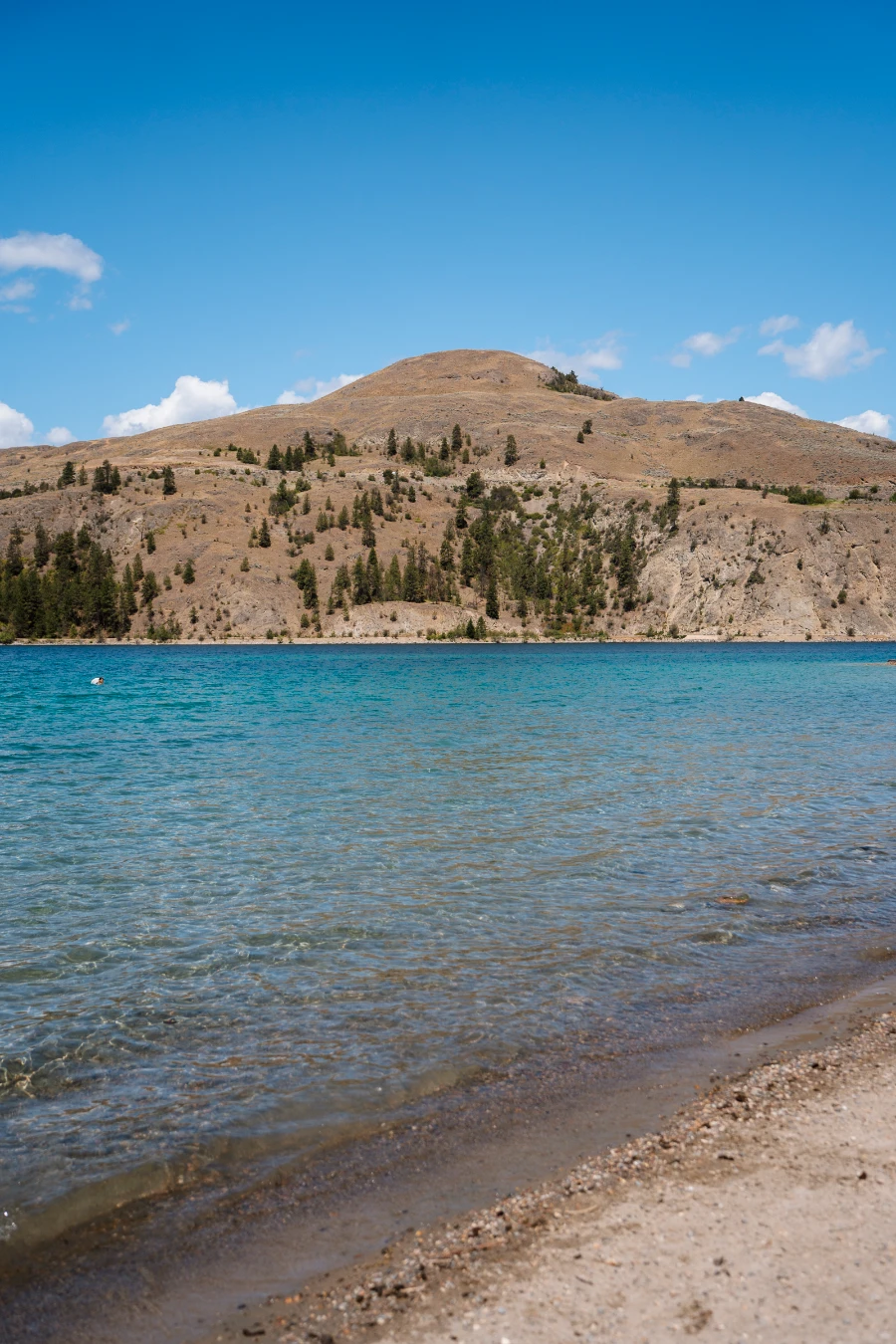 The shallow waters and white sand of Kal Beach in Vernon